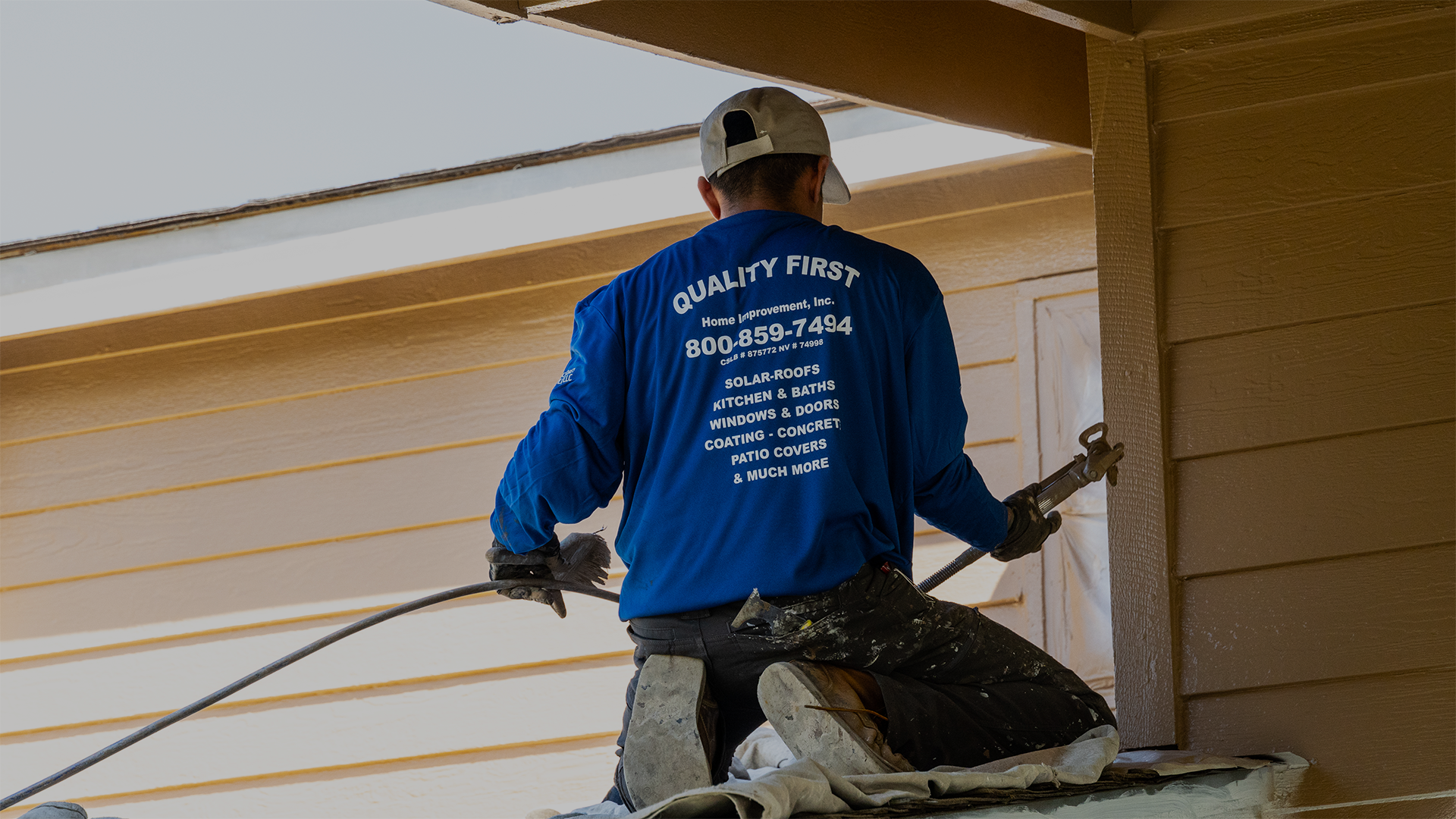 Quality First Home Improvement Installer Spraying Exterior Coating in Sacramento, CA